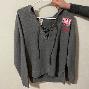 PINK badgers lace up sweater